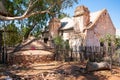 Hermannsburg view with old underground water tank and old house in Australia Royalty Free Stock Photo