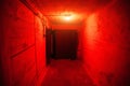 Hermetic armored door Soviet bunker inside and red light Royalty Free Stock Photo