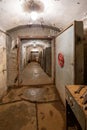 Hermetic rusty door of the bunker in underground abandoned tunnel. Mysterious old iron gate. Secret entrance Royalty Free Stock Photo