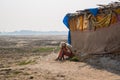 The hermit, a sadhu, sits meditating on the Holy river Ganges