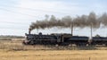 Vntage diesel powered steam engine showing black smoke