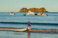 Hermosa beach, Costa Rica - December 14, 2021: Beautiful Playa Hermosa, Sentosa island and a man with a kayak, Costa Rica, Pacific