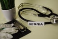 Hernia with inspiration and healthcare/medical concept on desk background