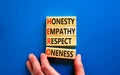 HERO honesty empathy respect oneness symbol. Concept words HERO honesty empathy respect oneness on blocks on beautiful blue