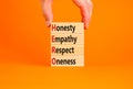 HERO honesty empathy respect oneness symbol. Concept words HERO honesty empathy respect oneness on blocks on beautiful orange