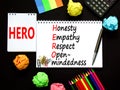 HERO honesty empathy respect open-mindedness symbol. Concept words HERO honesty empathy respect open-mindedness on the note on