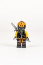 Hero toy Cole with a sword from a set of lego ninjago on a white background.