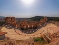 Herodion ancient open theatre under Acropolis and Athens city panorama.