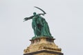 Heroes Square, Hosok tere, couple of Labor and Wealth statue, right side view, left colonnade, rainy day