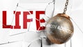 Heroin addiction and life - pictured as a word Heroin addiction and a wreck ball to symbolize that Heroin addiction can have bad