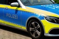 Police crowd control in the cityÃ¢â¬â¢s of Germany. Car door lettering: Polizei