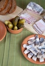 Herring, bread, pickles and bacon on a green napkin Royalty Free Stock Photo