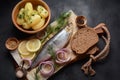 Herring fish  on wooden board  with pepper, herbs, red onion and lemon on black  background. Royalty Free Stock Photo