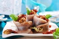 Herring rolls with dried tomato and walnuts