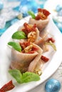 Herring rolls with dried tomatoes and walnuts for Christmas Royalty Free Stock Photo