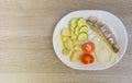 herring salad with vegetables on white plate top view Royalty Free Stock Photo