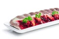 Herring slices stuffed with beetroot and potato arranged in a serving dish Royalty Free Stock Photo