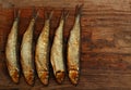 Herring sprat fish smoked wooden table