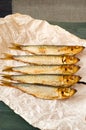 Herring sprat fish smoked wooden table Royalty Free Stock Photo