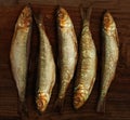 Herring sprat fish smoked on wooden table