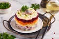 Herring under a fur coat. Layered salad with boiled eggs and vegetables: potato, carrot and beetroot