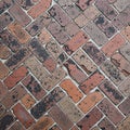 Herringbone pattern features bricks of red, brown, and black Royalty Free Stock Photo