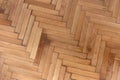 Herringbone pattern parquet wood floor texture. Wooden oak flooring background, overhead Royalty Free Stock Photo