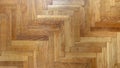 Herringbone pattern parquet wood floor texture. Wooden oak flooring background, overhead Royalty Free Stock Photo