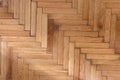 Herringbone pattern parquet wood floor texture. Wooden oak flooring background, overhead Royalty Free Stock Photo