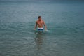 09.20.2008, Hersonissos, Crete, Greece. A young man standing in the water at the coast.