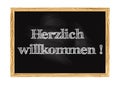 Herzlich willkommen - Welcome in German blackboard notice Vector illustration