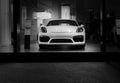 Herzliya, Israel- November, 2017: White Porsche 911 Carrera 4 car stands parked on the stage. Front view.