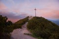 Herzogstand summit with wooden mountain cross, sunset scenery