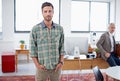 Hes ahead of the business curve. Portrait of a stylish young man standing in an office with a colleague in the