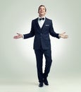 Hes arrived. A full length studio portrait of a young man posing confidently while wearing a vintage suit. Royalty Free Stock Photo