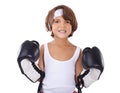 Hes an avid little boxer. Portrait of a young boy in boxing gear looking determined.