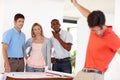 Hes always been a bit accident prone...a group of architects watching as their colleague falls to the ground. Royalty Free Stock Photo