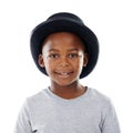 Hes a cool kid. Studio shot of a cute little boy wearing a funky hat against a white background. Royalty Free Stock Photo