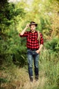 Hes a cowboy aint he. man checkered shirt on ranch. cowboy with lasso rope. Western. Vintage style man. Wild West retro Royalty Free Stock Photo