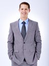 Hes dedicated to making a success of his career. Portrait of a happy businessman in studio. Royalty Free Stock Photo