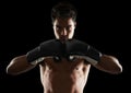 Hes dedicated to the sport of boxing. Portrait of a young male boxer in a fighting stance. Royalty Free Stock Photo