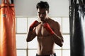 Hes dedicated to the sport of boxing. a young male boxer in a fighting stance. Royalty Free Stock Photo