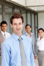 Hes earned the respect of his colleagues - Business Leader. A young business leader standing in front of his team Royalty Free Stock Photo