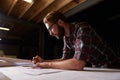 Hes an expert draftsman. a male architect drawing up building plans. Royalty Free Stock Photo