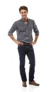 Hes feeling confident. Full-length portrait of a handsome young man standing with his hands on his hips. Royalty Free Stock Photo