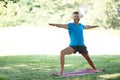 Hes found a tranquil yoga spot. Full length shot of a handsome mature man doing yoga outdoors. Royalty Free Stock Photo