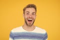 Hes really fun and happy. Happy man with big smile on yellow background. Handsome guy with beard and sexy smile on happy