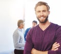 Hes a go-getter. Cropped portrait of a young businessman standing in an office.