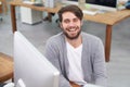 Hes a go-getter. Portrait of a handsome young man sitting at his office desk.