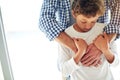 Hes got the blues. a sad little boy being comforted by his father at home. Royalty Free Stock Photo